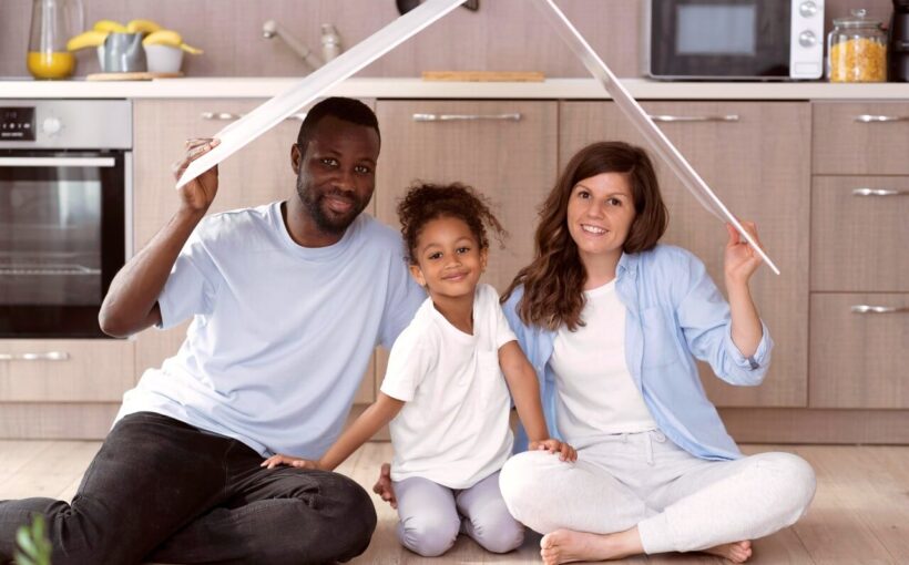 cute-family-holding-roof-their-head
